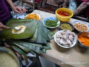 Spooning rice into tamale