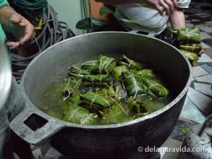 putting the tamales in the pot